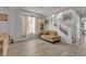 Bright living room with hardwood floors and a staircase to the second floor at 6461 Mount Eden Ave, Las Vegas, NV 89139