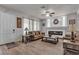 Spacious living room with hardwood floors, fireplace, neutral decor, and lots of light at 6461 Mount Eden Ave, Las Vegas, NV 89139