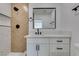 Modern bathroom featuring sleek fixtures, vanity with drawers, and decorative tile shower at 704 Stanford St, Las Vegas, NV 89107