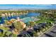 Stunning aerial view of the community's lake, pool, and surrounding residential area at 7624 Nocturne Ct, Las Vegas, NV 89128