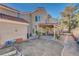 Backyard featuring a covered patio area and garden beds, ideal for outdoor enjoyment at 7624 Nocturne Ct, Las Vegas, NV 89128