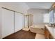 Bathroom featuring a combined shower and tub, plus a large closet at 7624 Nocturne Ct, Las Vegas, NV 89128