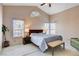 Bright bedroom with natural light, vaulted ceiling, and neutral carpeting at 7624 Nocturne Ct, Las Vegas, NV 89128