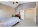 Comfortable bedroom featuring high ceilings, a ceiling fan, and a cozy seating area at 7624 Nocturne Ct, Las Vegas, NV 89128