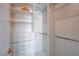 Organized walk-in closet with built-in shelves and drawers for efficient storage solutions at 7624 Nocturne Ct, Las Vegas, NV 89128