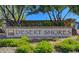 Attractive Desert Shores community sign surrounded by lush greenery at 7624 Nocturne Ct, Las Vegas, NV 89128