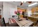 Inviting dining area near the kitchen with roses centered on the table at 7624 Nocturne Ct, Las Vegas, NV 89128