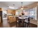 Dining area with adjacent island, a window view, and hardwood flooring at 7624 Nocturne Ct, Las Vegas, NV 89128