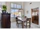 The dining area features a wood table with four chairs, leading to a modern kitchen at 7624 Nocturne Ct, Las Vegas, NV 89128