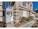 Close-up of front entrance with decorative door and well-kept landscaping at 7624 Nocturne Ct, Las Vegas, NV 89128