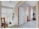 Upstairs hallway with carpet flooring, white walls, and a view of the stairway at 7624 Nocturne Ct, Las Vegas, NV 89128