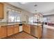 Well-lit kitchen with stainless steel appliances and a clear view into the dining and living areas at 7624 Nocturne Ct, Las Vegas, NV 89128