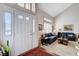 Bright entryway that flows into a large living room with ample natural light at 7624 Nocturne Ct, Las Vegas, NV 89128