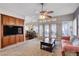 Spacious living room with built-in entertainment center and backyard access at 7624 Nocturne Ct, Las Vegas, NV 89128
