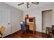 Office with wooden desk, ceiling fan, and hardwood floors, and doorway at 7624 Nocturne Ct, Las Vegas, NV 89128
