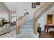 Elegant curved staircase leading to the upper level at 7624 Nocturne Ct, Las Vegas, NV 89128