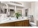 Bathroom with a white sink and cabinet, and large mirror at 8233 Valley Stream Ave, Las Vegas, NV 89131