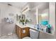 Bathroom featuring double sinks and vanity, with a shower visible at 8233 Valley Stream Ave, Las Vegas, NV 89131