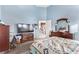 Spacious bedroom with blue walls, carpet, and a television at 8233 Valley Stream Ave, Las Vegas, NV 89131