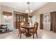 Cozy dining area with a china cabinet and bright natural light at 8233 Valley Stream Ave, Las Vegas, NV 89131