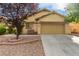 Inviting single-story home featuring a well-maintained front yard and a two-car garage at 8233 Valley Stream Ave, Las Vegas, NV 89131