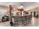 Modern kitchen with granite counters, stainless steel appliances, and bar seating at 8233 Valley Stream Ave, Las Vegas, NV 89131