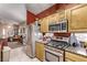 Modern kitchen with stainless steel appliances and ample cabinet space at 8233 Valley Stream Ave, Las Vegas, NV 89131