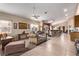 Bright living room with neutral walls, tile flooring and comfortable seating at 8233 Valley Stream Ave, Las Vegas, NV 89131