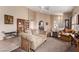 Bright living room with neutral walls, carpet flooring and comfortable seating at 8233 Valley Stream Ave, Las Vegas, NV 89131