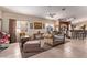 Bright living room with neutral walls, tile flooring and comfortable seating at 8233 Valley Stream Ave, Las Vegas, NV 89131