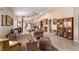 Bright living room with neutral walls, tile flooring and comfortable seating at 8233 Valley Stream Ave, Las Vegas, NV 89131