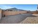 Backyard with block wall fence and low maintenance desert landscaping at 829 Stepney Pl, Henderson, NV 89011