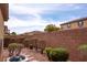 Backyard with brick wall, privacy, and a variety of shrubs and plants at 8376 Rygate Ave, Las Vegas, NV 89178