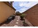 Serene backyard showcasing stone landscaping, privacy walls, and space for customization at 8376 Rygate Ave, Las Vegas, NV 89178
