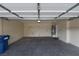 Spacious two car garage with high ceilings, ample room for storage, and access door at 8376 Rygate Ave, Las Vegas, NV 89178