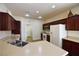Bright kitchen featuring stainless steel appliances, a breakfast bar, and ample counter space at 8376 Rygate Ave, Las Vegas, NV 89178