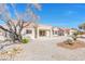 Backyard area with gravel landscaping and covered patio at 8513 Festival Dr, Las Vegas, NV 89134