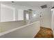 Hallway with neutral paint, carpet and lighting at 991 Ridge Path Ave, Henderson, NV 89015