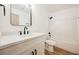 Modern bathroom featuring a white vanity, updated fixtures, and a shower-tub combo, ready for relaxation at 10229 Birch Bluff Ln, Las Vegas, NV 89145