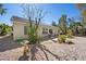 Cozy backyard featuring a patio area and desert landscaping for relaxed outdoor living at 10808 Aire Dr, Las Vegas, NV 89144