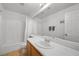 A cozy, carpeted bathroom with a shower/tub combo and vanity at 10808 Aire Dr, Las Vegas, NV 89144