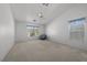 Carpeted bedroom with neutral walls, natural lighting, and blue chair at 10808 Aire Dr, Las Vegas, NV 89144