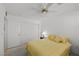 This bedroom features a ceiling fan, carpeted floors, closet, and a neutral color scheme at 10808 Aire Dr, Las Vegas, NV 89144