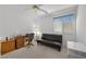 Neutral bedroom with desk and convertible futon at 10808 Aire Dr, Las Vegas, NV 89144