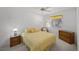 This carpeted bedroom offers natural light with a ceiling fan and traditional decor at 10808 Aire Dr, Las Vegas, NV 89144