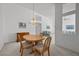 Dining area with wooden table and chairs, and natural lighting at 10808 Aire Dr, Las Vegas, NV 89144