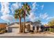 Inviting single-story home featuring desert landscaping and a two-car garage at 10808 Aire Dr, Las Vegas, NV 89144