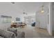 Spacious living room with carpet, large windows, and comfortable furniture arrangement at 10808 Aire Dr, Las Vegas, NV 89144