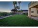 Large backyard features lush lawn, mature trees, and privacy wall at 1219 Diamond Valley St, Henderson, NV 89052