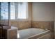 Relaxing bathroom featuring a soaking tub and natural light at 1219 Diamond Valley St, Henderson, NV 89052